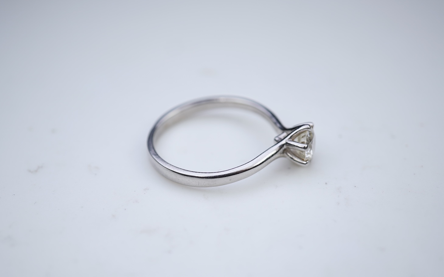 A diamond solitaire ring